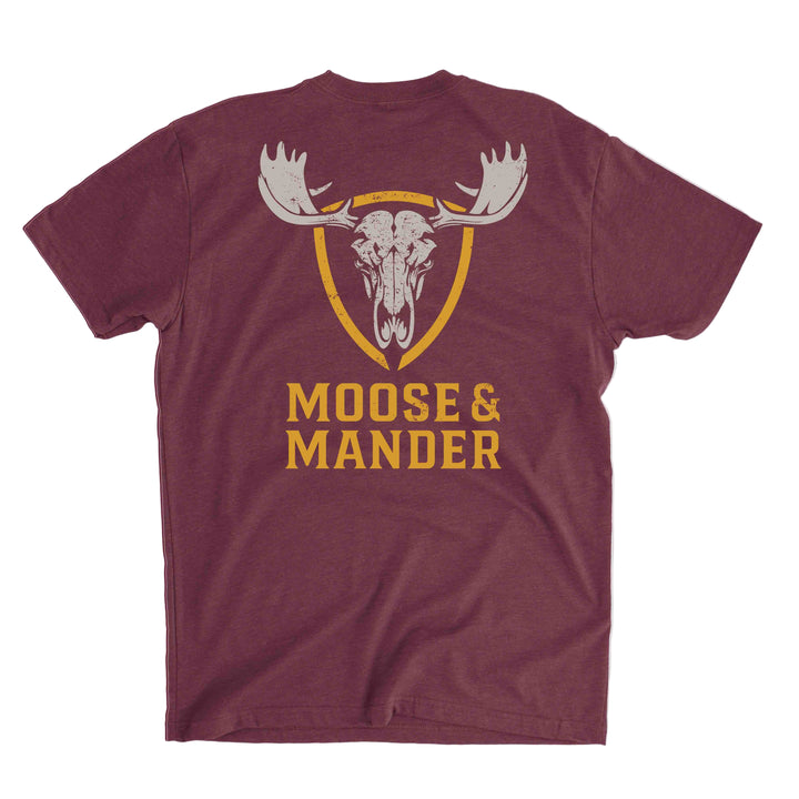 Maroon t-shirt with moose and Mander logo on a gray background